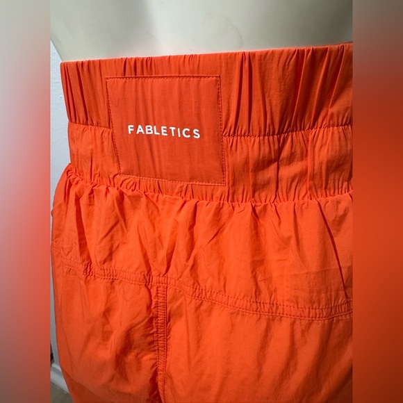 NWT Fabletics High-Waisted Piped Nylon Pant in Passion Orange - Picture 9 of 12